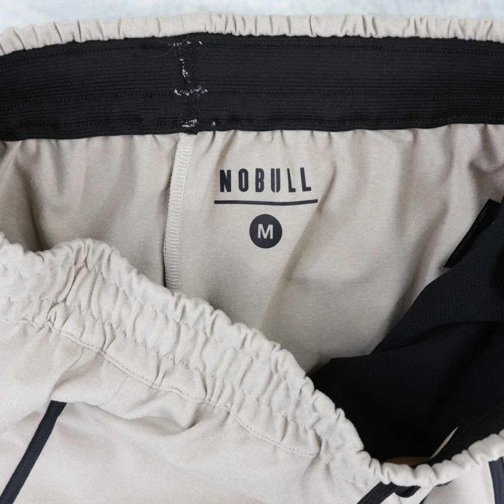 NOBULL Jogger Pants Mens Medium Tan Zipper Pockets Tapered Training Sweatpants